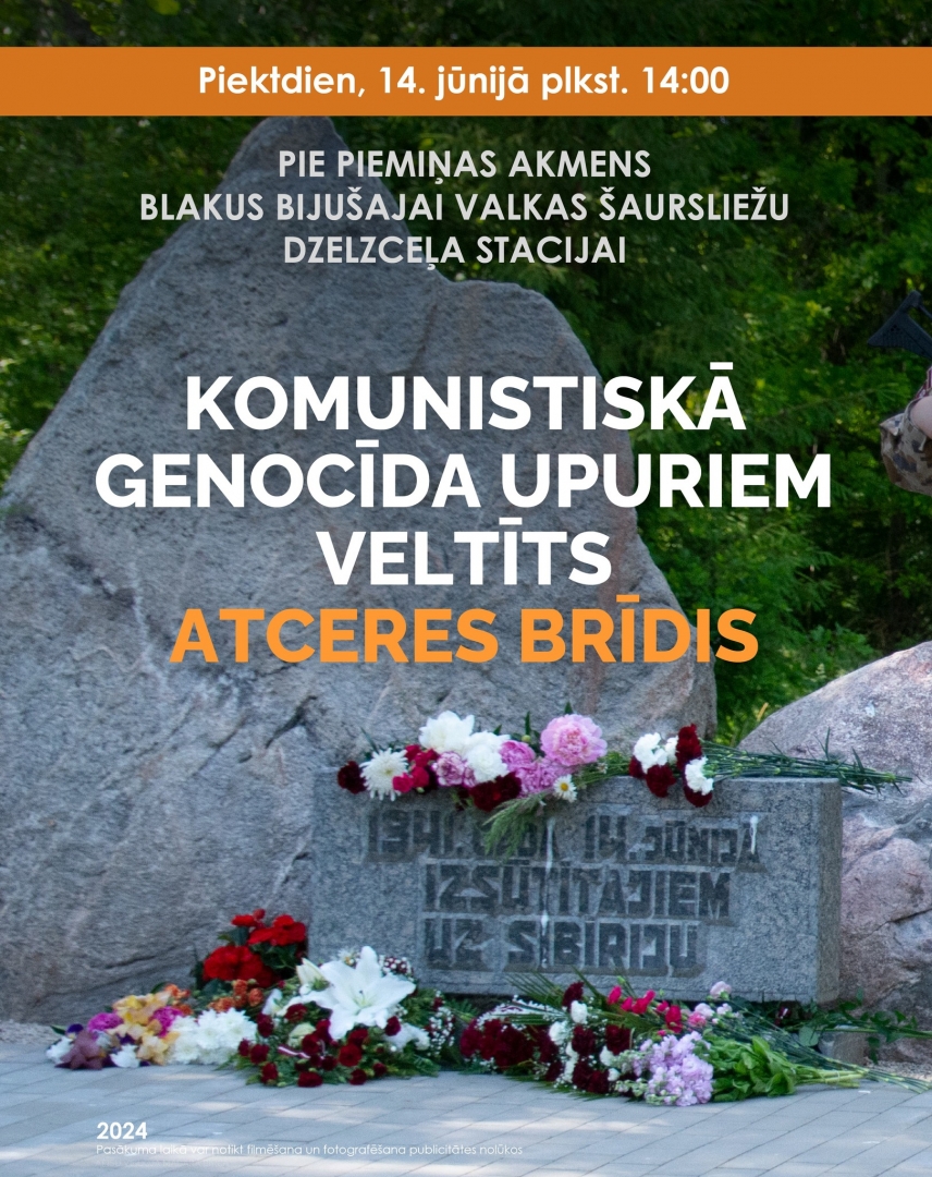 Piemiņas akmens ar ziediem