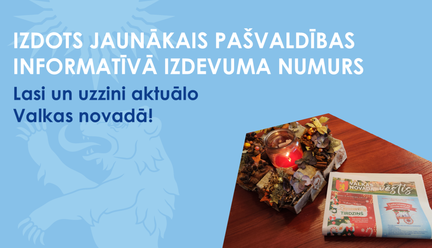 Zils baneris ar Valkas ģerboņa lāci un jaunās avīzes fotogrāfiju ar sveci